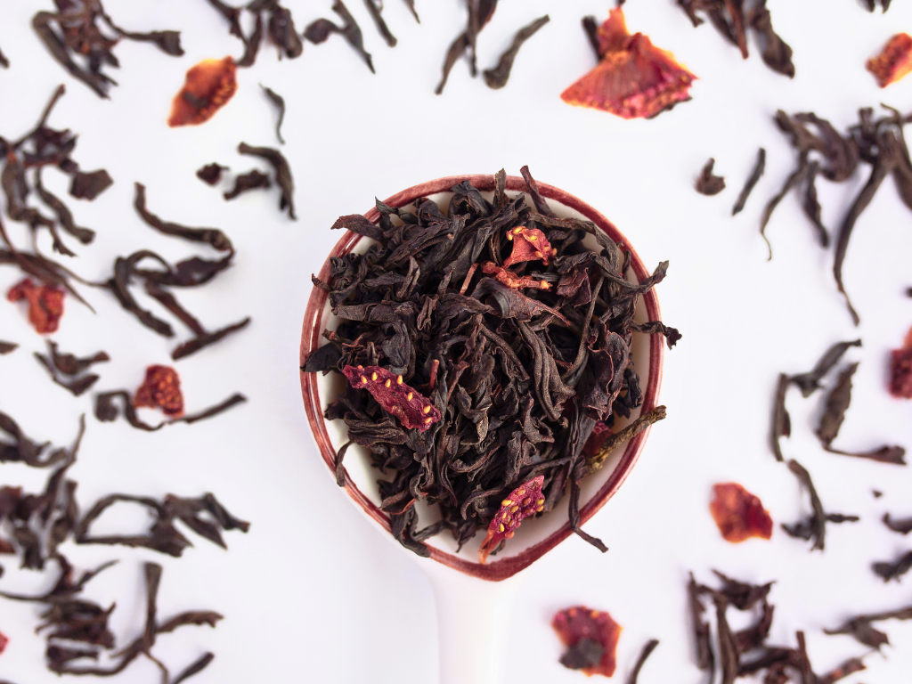 Strawberry Black Tea by Pembroke tea's Black tea leaves with dried red berries - shows high quality of leaves and natural strawberries